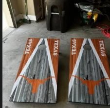 Texas Longhorns cornhole set with a weathered wood triangle